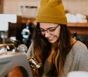 girl in a yellow toque smiling